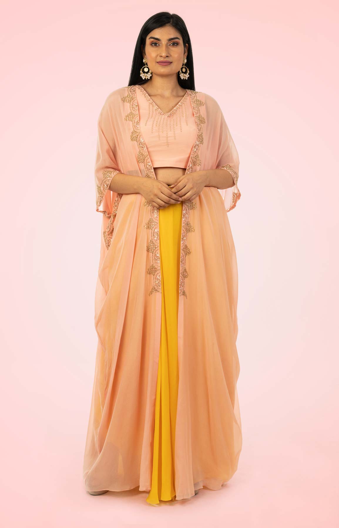 Mustard Draped Skirt Paired With Hand Embroidered Peach Crop Top And Kaftan Style Jacket – Viraaya By Ushnakmals